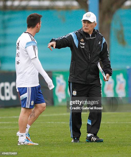 Alejandro Sabella head coach of Argentina gives instructions to Lionel Messi of Agerntina during an Argentina training session at Ezeiza Training...