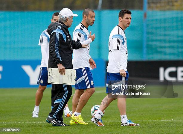 Alejandro Sabella head coach of Argentina gives instructions to his players during an Argentina training session at Ezeiza Training Camp on May 31,...