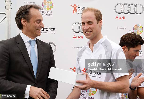 Andre Konsbruck, Director of Audi UK, and Prince William, Duke of Cambridge, attend day one of the Audi Polo Challenge at Coworth Park Polo Club on...
