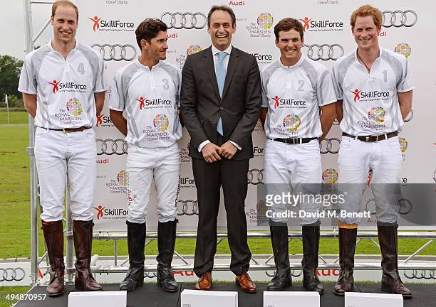 Prince William, Duke of Cambridge, Nic Roldan, Andre Konsbruck, Director of Audi UK, Alec White and Prince Harry attend day one of the Audi Polo...