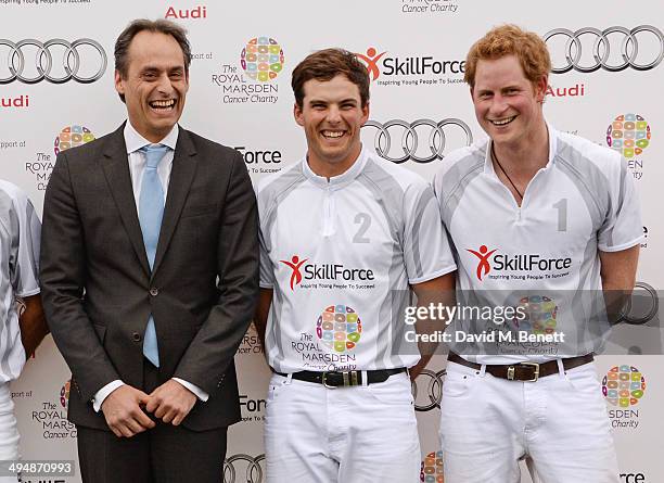 Andre Konsbruck, Director of Audi UK, Alec White and Prince Harry attend day one of the Audi Polo Challenge at Coworth Park Polo Club on May 31, 2014...