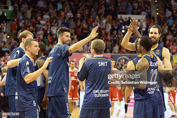 Players of Oldenburg celebrate after winning game three of the 2014 Beko BBL Playoffs Semi-Final between FC Bayern Muenchen and EWE Baskets Oldenburg...