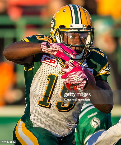 Greg Morris of the Edmonton Eskimos runs with the ball in the game between the Edmonton Eskimos and Saskatchewan Roughriders in week 18 of the 2015...