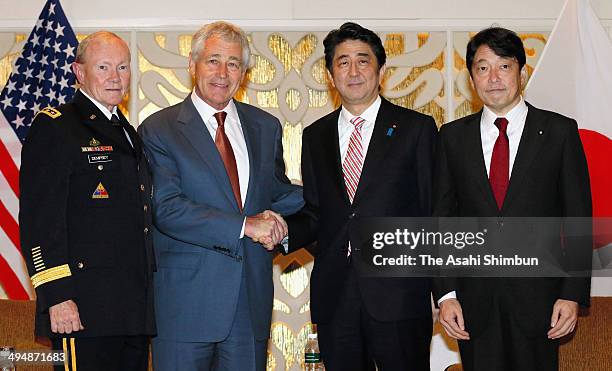 Defense Secretary Chuck Hagel poses with Japanese Prime Minister Shinzo Abe , Japanese Defense Minister Itsunori Onodera and Gen. Martin Dempsey,...