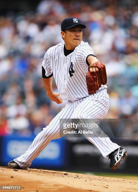Masahiro Tanaka of the New York Yankees pitches against the Minnesota Twins in the first inning during their game at Yankee Stadium on May 31, 2014...