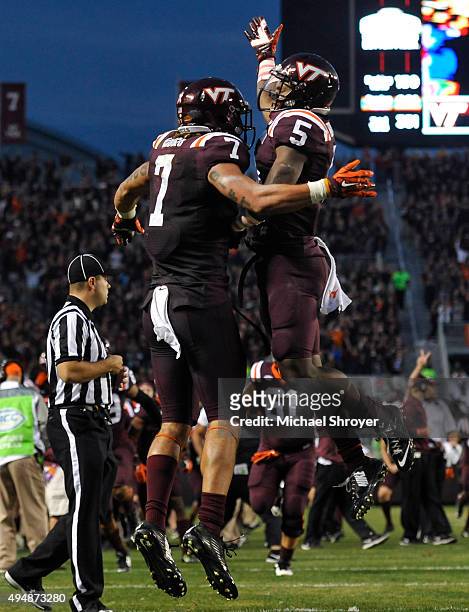 Tight end Bucky Hodges of the Virginia Tech Hokies celebrates his touchdown reception with wide receiver Cam Phillips in the fourth quarter against...