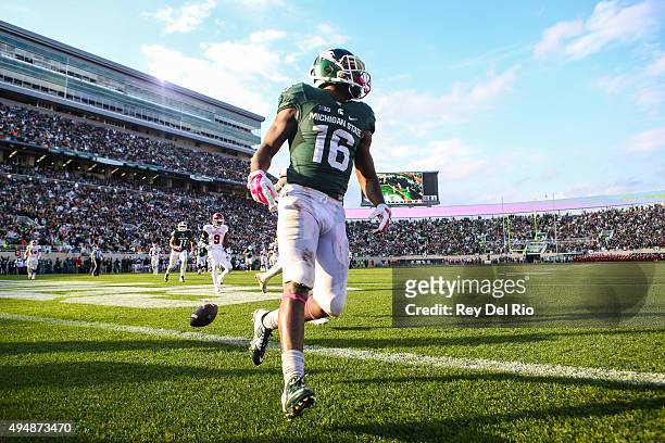 Aaron Burbridge of the Michigan State Spartans celebrates his touchdown in the third quarter against the Indiana Hoosiers at Spartan Stadium on...