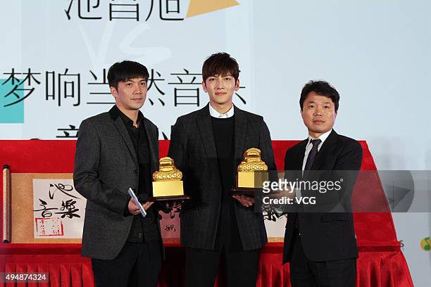 South Korea actor Ji Chang Wook attends a press conference to promote his new song as he signs cooperation with a Chinese concert band music...