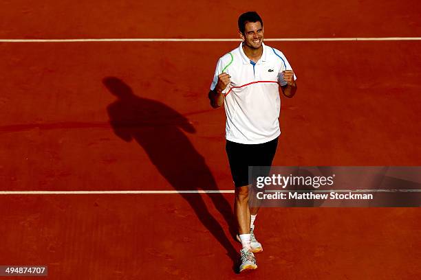 Guillermo Garcia-Lopez of Spain celebrates victory in his men's singles match against Donald Young of the United States on day seven of the French...