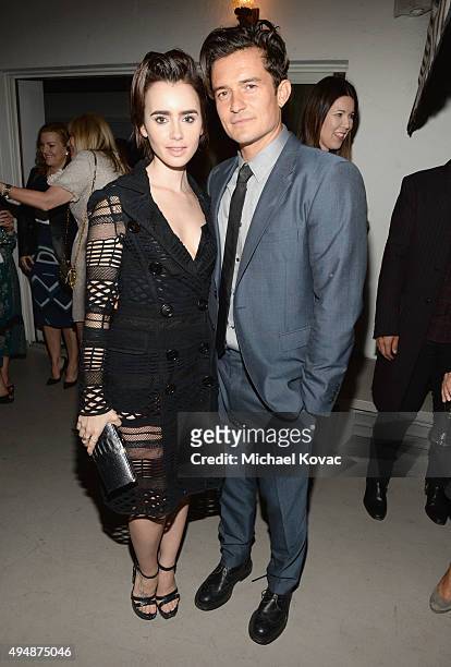 Actress Lily Collins and actor Orlando Bloom attends James Corden, Vanity Fair And Burberry Celebrate The 2015 British Academy BAFTA Los Angeles...