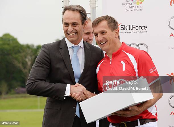 Andre Konsbruck, Director of Audi UK, and Spencer McCarthy attend day one of the Audi Polo Challenge at Coworth Park Polo Club on May 31, 2014 in...