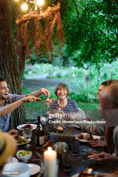 family having fun during garden party - family vertical stock pictures, royalty-free photos & images