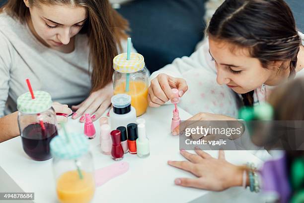 teenage girls sleepover beauty treatment. - three nails stock pictures, royalty-free photos & images