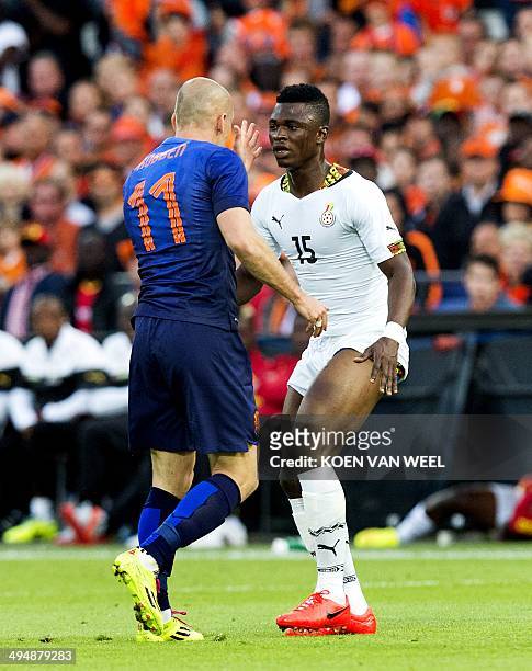 Dutch forward Arjen Robben argues with Ghanian defender Rashid Sumaila during the friendly football match Netherlands vs Ghana at the Kuip Stadium in...