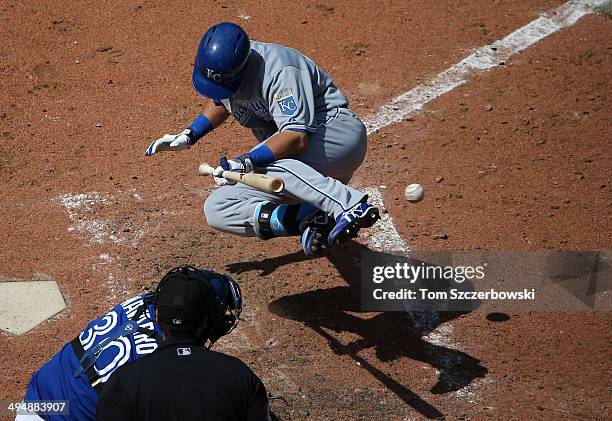 Norichika Aoki of the Kansas City Royals reacts after being hit by a pitch with the bases loaded in the seventh inning during MLB game action against...