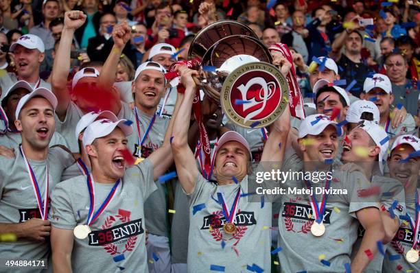 Players of Sparta Prague celebrate with a trophy after winning the Czech soccer league title on May 31, 2014 in Prague, Czech Republic.