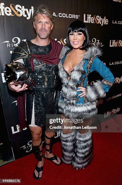 Tv personalities Slade Smiley and Gretchen Rossi attend Life & Style Weekly's "Eye Candy" Halloween Bash hosted by LeAnn Rimes at Riviera 31 at...