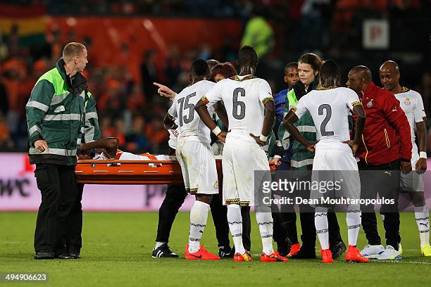 Jerry Akaminko of Ghana is injured and carried off by medical staff during the International Friendly match between Netherlands and Ghana at De Kuip...