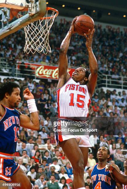 Vinnie Johnson of the Detroit Pistons goes up for a layup against the New York Knicks during an NBA basketball game circa 1984 at the Pontiac...