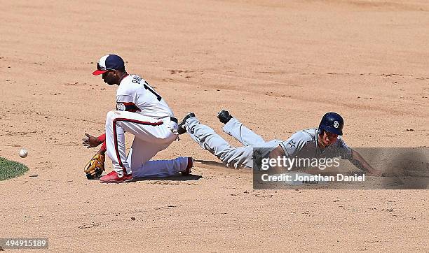 Will Veeable of the San Diego Padres dives safely back into second base as Alexei Ramirez of the Chicago White Sox awaits the throw in the 6th inning...