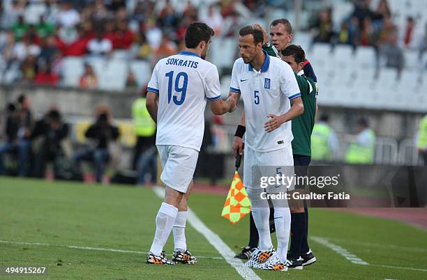 Papastathopoulos of Greece leaves injured replaced by Vangelis Moras during the International Friendly between Portugal and Greece at the National...