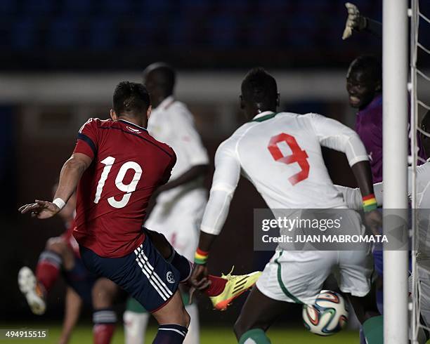 Colombia's forward Teofilo Gutierrez strikes to score against Senegal during a friendly football match at Pedro Bidegain stadium in Buenos Aires,...