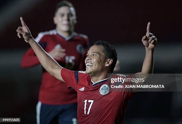 Colombia's forward Carlos Bacca celebrates after scoring the team's second goal against Senegal during a friendly football match at Pedro Bidegain...