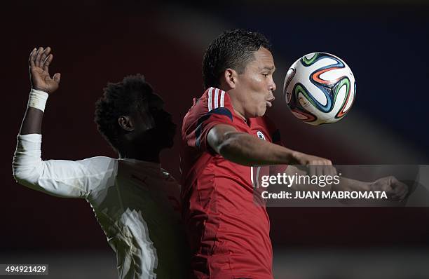 Colombia's forward Carlos Bacca vies for the ball with Senegal's defender Diawandou Diagne during a friendly football match, at Pedro Bidegain...