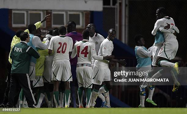 Senegal's footballers celebrate after Cheikh Tidiane Ndoye scored the team's second goal against Colombia during a friendly football match, at Pedro...