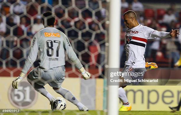 Luis Fabiano of Sao Paulo fights for the ball with goalkeeper Giovanni of Atletico MG, during a match between Sao Paulo x Atletico MG of Brasileirao...