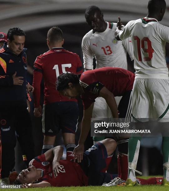 Colombia's midfielder Alexander Mejia gestures after being fouled by Senegal's defender Ibrahima Khaliloulah Seck during a friendly football match at...