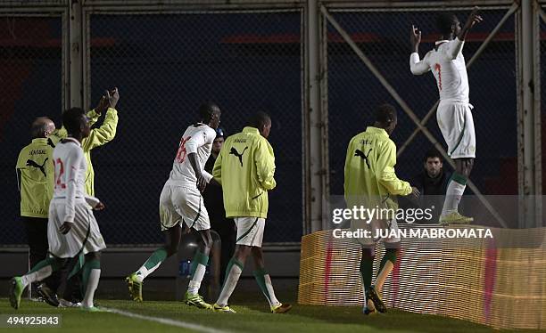 Senegal's footballers celebrate at the end of a friendly football match against Colombia, at Pedro Bidegain stadium in Buenos Aires, Argentina on May...