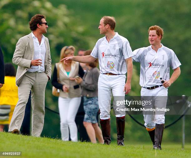 Prince William, Duke of Cambridge and Prince Harry talk with Thomas van Straubenzee after playing in the Audi Polo Challenge at Coworth Park Polo...