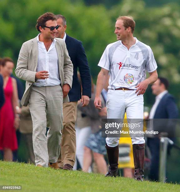 Prince William, Duke of Cambridge talks with Thomas van Straubenzee after playing in the Audi Polo Challenge at Coworth Park Polo Club on May 31,...