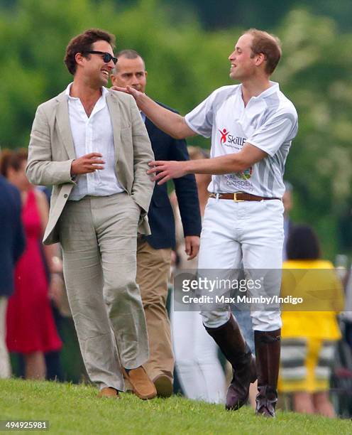 Prince William, Duke of Cambridge talks with Thomas van Straubenzee after playing in the Audi Polo Challenge at Coworth Park Polo Club on May 31,...