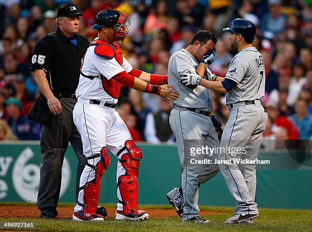 Pierzynski of the Boston Red Sox walks Ali Solis of the Tampa Bay Rays towards his teammate David DeJesus after being hit with a bounced ball in the...