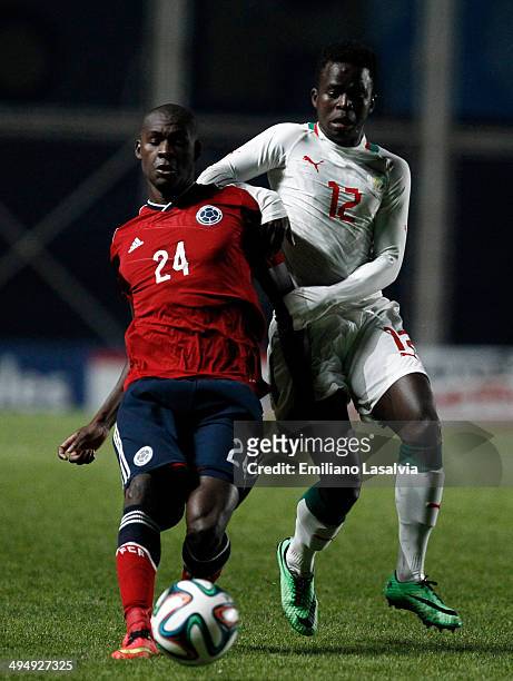 Victor Ibarbo of Colombia fights for the ball with Mamadou Ndiaye of Senegal during the International Friendly match between Colombia and Senegal at...