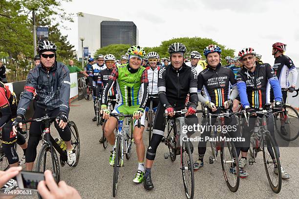 Professional road racing cyclists Ted King and George Hincapie participate in the Best Buddies Challenge: Hyannis Port on May 31, 2014 in Boston,...