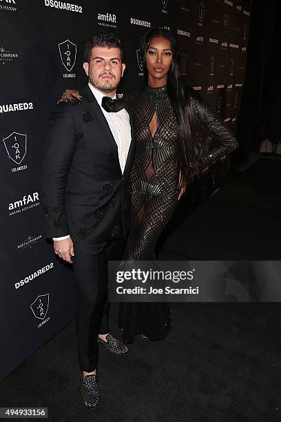 Singer Eli 'Henree' Mizrahi and model Jessica White attend amfAR's Inspiration Gala Los Angeles after party at 1OAK on October 29, 2015 in West...