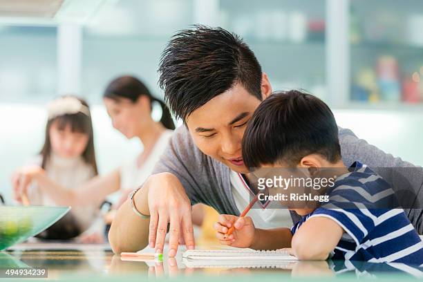 chinese family - asian teacher stock pictures, royalty-free photos & images