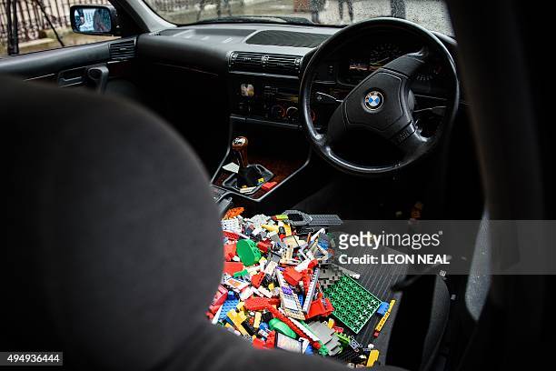 Lego bricks are seen inside a BMW 5 series car, used as a receptacle for donations of Lego bricks in the courtyard of the Royal Academy in central...