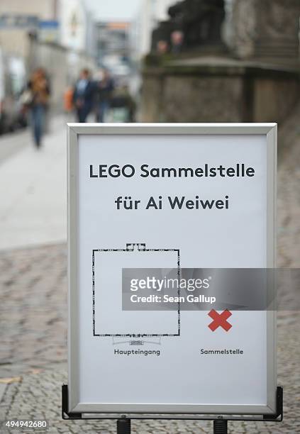 Sign indicates the location of a collection point for Lego donations for Chinese artist Ai Weiwei next to Martin-Gropius-Bau museum on October 30,...