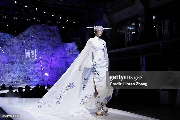 Model showcases designs on the runway at Heaven Gaia Xiong Ying High Fashion Collection show during the Mercedes-Benz China Fashion Week...