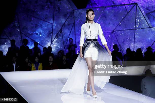 Model showcases designs on the runway at Heaven Gaia Xiong Ying High Fashion Collection show during the Mercedes-Benz China Fashion Week...