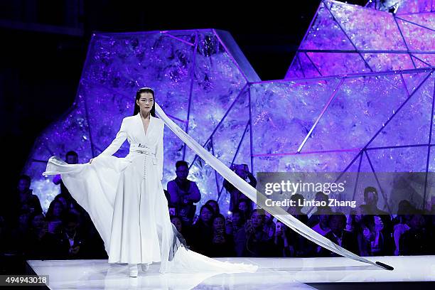 Model showcases designs on the runway at Heaven Gaia Xiong Ying High Fashion Collection show during the Mercedes-Benz China Fashion Week...