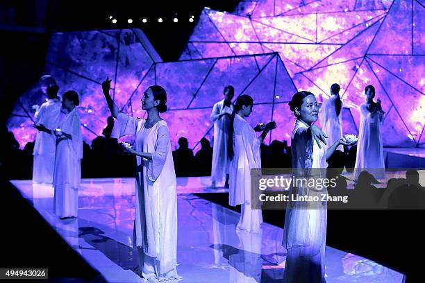 Models showcases designs on the runway at Heaven Gaia Xiong Ying High Fashion Collection show during the Mercedes-Benz China Fashion Week...