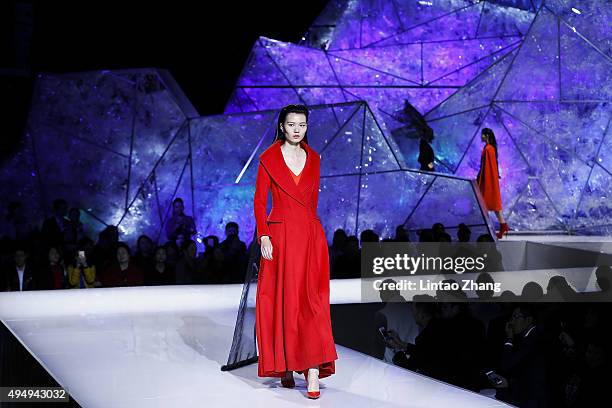 Model showcases designs on the runway at Heaven Gaia Xiong Ying High Fashion Collection show during the Mercedes-Benz China Fashion Week...