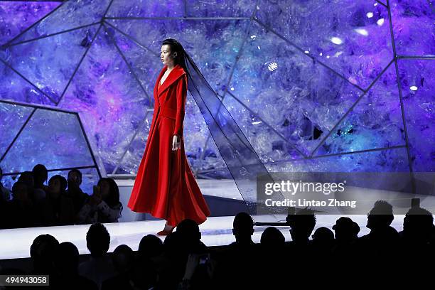 Model showcases designs on the runway at Heaven Gaia Xiong Ying High Fashion Collection show during the Mercedes-Benz China Fashion Week...