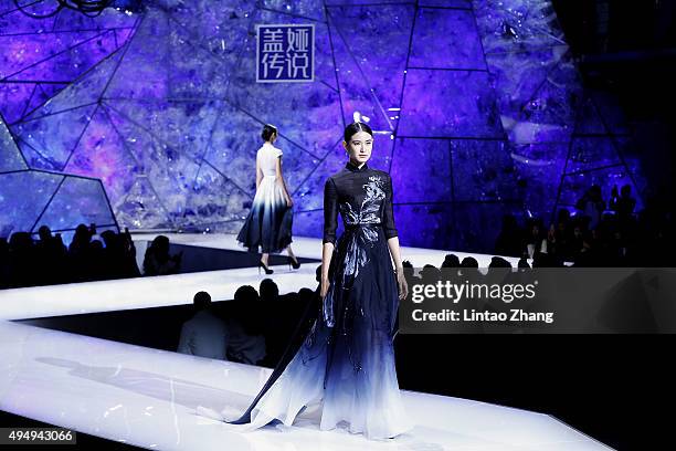 Models showcases designs on the runway at Heaven Gaia Xiong Ying High Fashion Collection show during the Mercedes-Benz China Fashion Week...