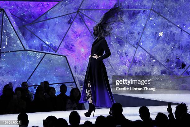 Model showcases designs on the runway at Heaven Gaia Xiong Ying High Fashion Collection show during the Mercedes-Benz China Fashion Week...